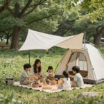 인천대공원 피크닉 완벽 준비 가이드 인천대공원 그늘막 텐트 존에서 가족이 피크닉을 즐기고 있는 모습