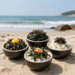 기장 대변항 이화장횟집에서 바다를 배경으로 차려진 멸치회, 멸치쌈밥, 멸치구이 세트 요리